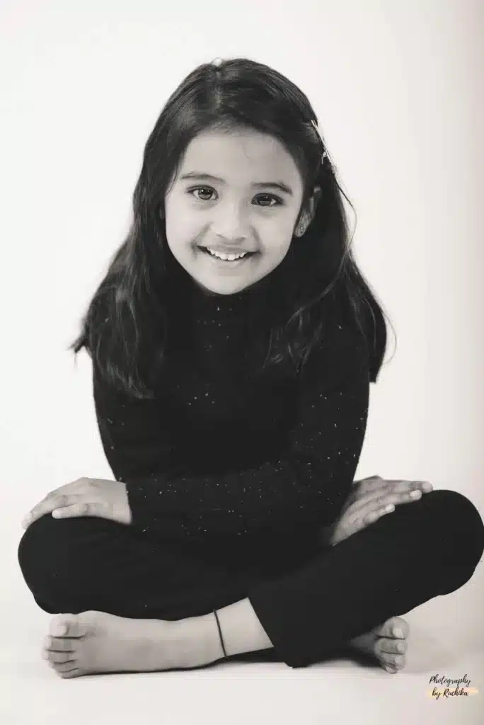 Child dressed in a fairy costume posing for a magical portrait in Wellington